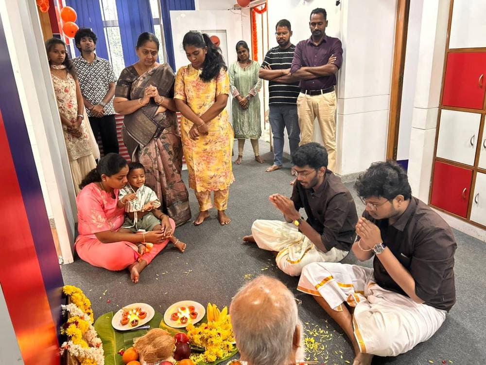 Founders and family seeking blessings during the office pooja